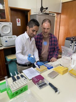 Dr. Ulrich Lutz with Arvind Ramburn from the Parmessur team, during a training session in the lab of the Biotechnology department of the MSIRI